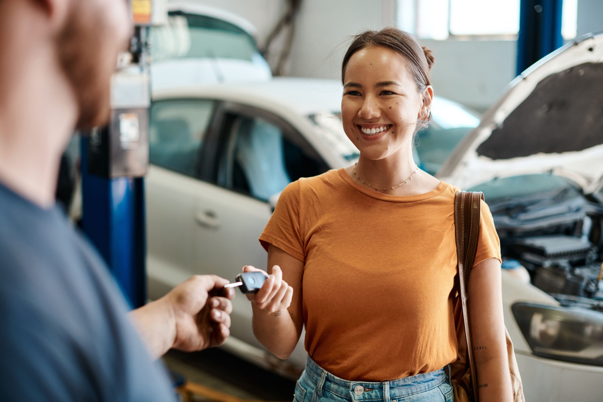 Shot of a woman receiving her car keys